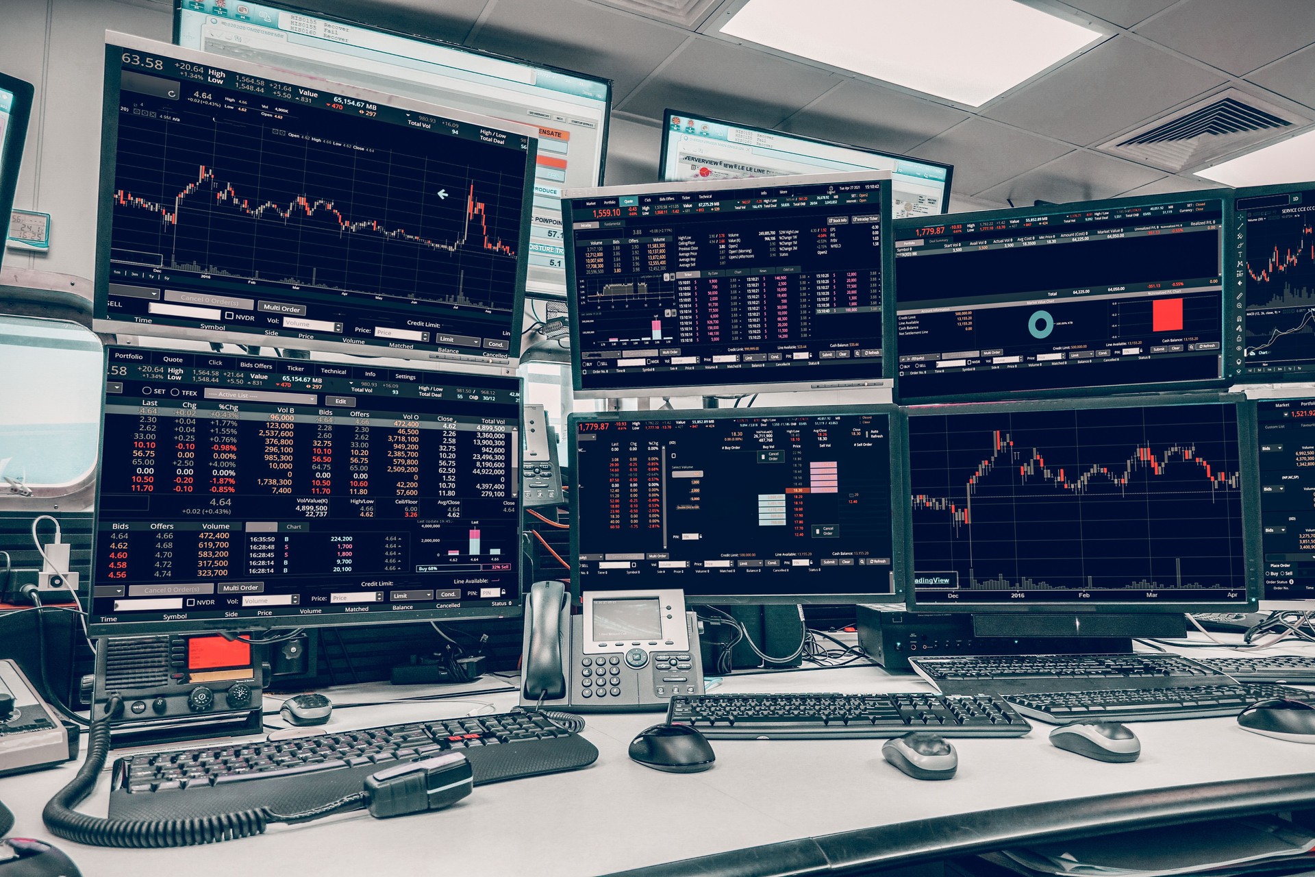 group of stock data monitor analyzing data stock market in monitoring room on the data presented in the chart, forex trading graph, stock exchange trading online, financial investment.